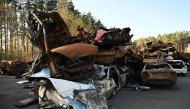 This photograph taken in Irpin, near Kyiv, on November 7, 2024, shows the symbolic cemetery of destroyed civilian cars. (Photo by Genya Savilov / AFP)