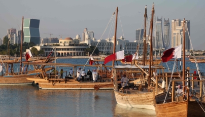 Traditional wooden boats sail during the 14th Traditional Dhow Festival at the Katara Cultural Village Foundation in Doha on November 27, 2024. (Photo by Karim Jaafar / AFP)