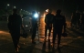 Policemen stand guard at the Red Zone area, early in Islamabad on November 27, 2024. (Photo by Aamir Qureshi / AFP)