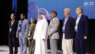 President of UDST Dr. Salem Al Naemi (centre) with other participants during the event.