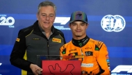 McLaren's British driver Lando Norris is presented with the Pirelli sprint qualifying award after the sprint qualifying session ahead of the Formula One Qatar Grand Prix at the Lusail International Circuit  on November 29, 2024. (Photo by Darko Bandic / POOL / AFP)