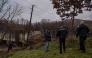 Kosovo police and security officers stand next to a site damaged by an explosion in the village of Varage near the town of Zubin Potok on November 30, 2024. Photo by Armend NIMANI / AFP.