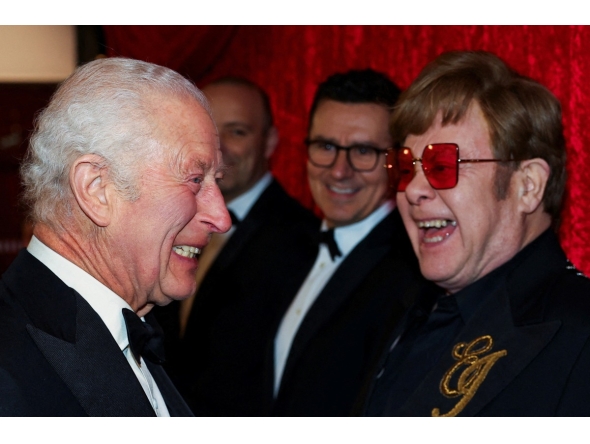 Britain's King Charles III reacts as he meets Elton John as he attends the Royal Variety Performance at the Royal Albert Hall in London on November 22, 2024. (Photo by Toby Melville / POOL / AFP)