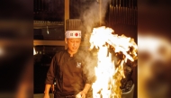 A chef at work at Nozomi Doha.