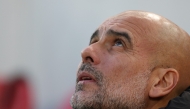 Manchester City's Spanish manager Pep Guardiola looks on from his seat ahead of kick-off in the English Premier League football match between Liverpool and Manchester City at Anfield in Liverpool, north west England on December 1, 2024. Photo by Adrian Dennis / AFP.