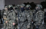 Soldiers try to enter the National Assembly building in Seoul on December 4 2024, after South Korea President Yoon Suk Yeol declared martial law. South Korea's President Yoon Suk Yeol on December 3 declared martial law, accusing the opposition of being 