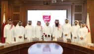 Chairman of the Race’s Organizing Committee Sheikh Suhaim bin Mohammed Al Thani, Executive Director of the Qatar Athletics Federation Khalid Rashid Al Marri, QOC’s Assistant Director of the Sports Events Department Salah Mahmoud Al Saadi and QOC’s Head of Media Relations Sheikh Hamad bin Abdulaziz Al Thani along with other officials pose for a group photo.  