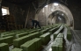 (Files) A Syrian worker stacks laurel soap at the Jbaili soap factory, an 800 year old artisanal soap manufacturer, in the old city of Syria's northern city of Aleppo on January 24, 2022. (Photo by AFP)
 