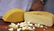 Handout picture released by Minas Gerais Culture Department (Secult-MG) shows a handmade Minas Cheese during an exhibition at the city of Belo Horizonte, Minas Gerais state, Brazil on October 19, 2024. (Photo by Renata Garbocci / Minas Gerais Culture Department (Secult-MG) / AFP) 