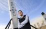 Inspiration4 mission commander Jared Isaacman, founder and chief executive officer of Shift4 Payments, stands for a portrait in front of the recovered first stage of a Falcon 9 rocket at Space Exploration Technologies Corp. (SpaceX) on February 2, 2021 in Hawthorne, California. (Photo by Patrick T. Fallon / AFP)