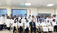 Dr. Mohammad Yousef (front, fourth from left) along with other officials accompanied  WCM-Q pre-medical students on a field trip to HMC’s National Centre for Cancer Care and Research.