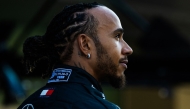 Mercedes' British driver Lewis Hamilton poses for a group photo with their team ahead of the Abu Dhabi Formula One Grand Prix at the Yas Marina Circuit in Abu Dhabi on December 5, 2024. (Photo by Andrej ISAKOVIC / AFP)