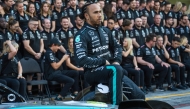 Mercedes' British driver Lewis Hamilton poses for a photo with his team ahead of the Abu Dhabi Formula One Grand Prix at the Yas Marina Circuit in Abu Dhabi on December 5, 2024. (Photo by Andrej Isakovic / AFP)