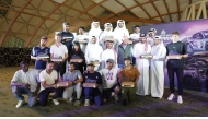 The winners of the 2024 Qatar Off Road Championship cars categories pose for a photo with officials.