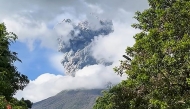 This frame grab from video footage taken on December 9, 2024 and posted on the Facebook account of Dianne Paula Abendan shows the eruption of Kanlaon volcano as seen from Biak na Bato village in La Castellana town in Negros Occidental province, central Philippines. (Photo by Dianne Paula Abendan / various sources / AFP)