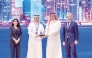 Minister of Communications and Information Technology, H E Mohammed bin Ali Al Mannai, presenting the award to MoCI official.