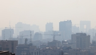 Smog covers Tehran on December 7, 2024 amid severe air pollution. Photo by ATTA KENARE / AFP.
