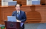 South Korean Prime Minister Han Duck-soo attends a plenary session, where a question-and-answer session was held relating to the martial law declaration, at the National Assembly in Seoul on December 11, 2024. South Korean police raided President Yoon Suk Yeol's office on December 11 as the investigation into his declaration of martial law gathered pace. (Photo by JUNG YEON-JE / AFP)