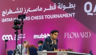 India's Arjun Erigaisi (right) competes against compatriot Murali Karthikeyan (unseen) during the eighth round of the Qatar Masters Open 2024.