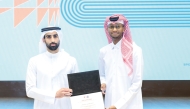 QOC Director of Sport Sector Sheikh Khalifa bin Khalid Al Thani honours Qatar's high jump legend Mutaz Barshim after the forum.