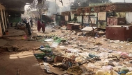 File photo for representational purposes only showing people walking among scattered objects in the market of El Geneina, the capital of West Darfur on April 29, 2023. (AFP)
