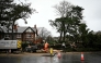 Arborists cut a tree blocking a road in Birkenhead, near Liverpool, on December 7, 2024 as storm Darragh brings winds of nearly 90 mph to the west of Wales and north-west England. (Photo by Paul Ellis / AFP)
