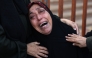 A Palestinian woman cries outside Nasser Hospital in Khan Yunis in the south Gaza Strip, on December 12, 2024. (Photo by Bashar Taleb / AFP)