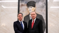 US Secretary of State Antony Blinken (left) and Turkiye's President Recep Tayyip Erodgan before a picture of the founder and first president of the Turkish Republic Mustafa Kemal Ataturk, during their meeting at Ankara Esenboga Airport on December 12, 2024. (Photo by Andrew Caballero-Reynolds / POOL / AFP)