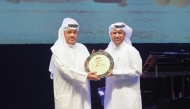 Katara General Manager Professor Dr. Khalid bin Ibrahim Al honouring Qatari artist Ghanem Al Sulaiti with the ‘Drama Award’. 