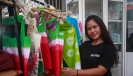 Filipino drug convict on death row in Indonesia, Mary Jane Veloso, shows a batik design she created during her time at Yogyakarta Women's Correctional Institution Class IIB in Wonosari, Yogyakarta on December 13, 2024. (Photo by Devi Rahman / AFP)