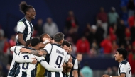 Pachuca's players celebrate winning the penalty shoot-out during the 2024 FIFA Intercontinental Cup football match between Mexico's Pachuca and Egypt's Al-Ahly at Stadium 974 in Doha on December 14, 2024. (Photo by Mahmud HAMS / AFP)