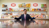 This picture taken on August 5, 2024 shows Lekh Juneja, chairman and CEO of Kameda Seika, posing for photos at the company's headquarters in Niigata city, Niigata prefecture. (Photo by Yuichi Yamazaki / AFP)