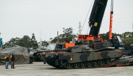 This handout photo taken and released on December 16, 2024 by Taiwan's Ministry of National Defense shows a US-made M1A2 Abrams battle tank rolling down from a trailer at an army armour training centre in Hsinchu County, Hsinchu. Photo by Handout / Taiwan's Ministry of National Defense / AFP.