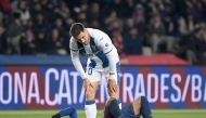 Barcelona's Spanish forward #19 Lamine Yamal reacts on the ground during the Spanish league football match between FC Barcelona and Club Deportivo Leganes SAD at the Estadi Olimpic Lluis Companys in Barcelona on December 15, 2024. (Photo by Josep LAGO / AFP)
