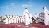 A troupe performs on traditional songs as part of Qatar National Day celebrations, at Katara Cultural Village.