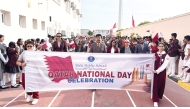 Students and school officials attending the Qatar National Day celebration.