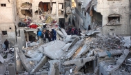 People look for survivors following an Israeli strike on a home belonging to the al-Zaytouniyah family, in the al-Daraj neighbourhood in Gaza City, in the central Gaza Strip on December 19, 2024. (Photo by Omar Al-Qattaa / AFP)