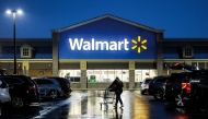 File photo of a shopper pushing a cart through the parking lot of a Walmart on the morning of Black Friday in Wilmington, Delaware. (AFP)