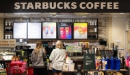 Customers order at a Starbucks in Manhattan Beach, California, on July 19, 2024. Photo by ETIENNE LAURENT / AFP