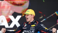 Red Bull Racing's Dutch driver Max Verstappen celebrates at the podium of the Formula One Sao Paulo Grand Prix, at the Jose Carlos Pace racetrack, aka Interlagos, in Sao Paulo, Brazil, on November 3, 2024. (Photo by Miguel Schincariol / AFP)