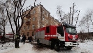 In this handout photograph taken and released on the official Telegram account of the Mayor's Office of Kazan on December 21, 2024, a Russian rescuer works in the courtyard of a residential building following a drone attack in Kazan, amid the ongoing Russian-Ukrainian conflict. (Photo by Handout / Telegram / @kzn_official / AFP) 