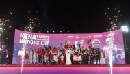 Executive Director of Qatar Motor and Motorcycle Federation (QMMF) and CEO of Lusail International Circuit (LIC) Amro Al Hamad with the top three teams of the MENA Nations Cup at the Lusail International Circuit yesterday. Lebanon won first position, Morocco were ranked second and UAE third overall.