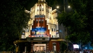 Pedestrians walk past the Eros Cinema, a UNESCO-designated Art Deco cinema theatre in the Cambata Building at Churchgate in Mumbai. (Photo by Indranil Mukherjee / AFP)
