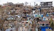 This photograph shows damaged homes in the city of Mamoudzou on the French Indian Ocean territory of Mayotte, after the cyclone Chido hit the archipelago on December 22, 2024. (Photo by Patrick Meinhardt / AFP)