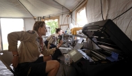 A handout photo from the Australian Department of Foreign Affairs and Trade, dated December 22, 2024, shows Australian disaster response team members operating a station to support local authorities in Port Vila after a powerful earthquake struck Vanuatu's capital on December 17. Photo by Niki Kuatonga / AUSTRALIA'S DEPARTMENT OF FOREIGN AFFAIRS AND TRADE / AFP