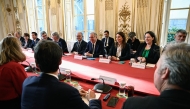 France's Prime Minister Francois Bayrou (C) attends a meeting with the President of the French National Assembly Yael Braun-Pivet (L), Senate President and party leaders excluding La France Insoumise (LFI) nor Rassemblement National party (RN), to finalise his government at the Hotel Matignon in Paris, on December 19, 2024. Photo by JULIEN DE ROSA / POOL / AFP.