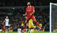 Liverpool's Egyptian striker #11 Mohamed Salah celebrates after scoring their fifth goal during the English Premier League football match between Tottenham Hotspur and Liverpool at the Tottenham Hotspur Stadium in London, on December 22, 2024. (Photo by Glyn Kirk / AFP)