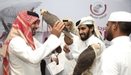 Falconers during the registration of the Qatar International Falconry and Hunting Festival (Marmi 2025) in Katara yesterday. 