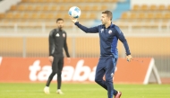 Qatar coach Luis Garcia leads training session yesterday.