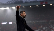 Manchester United's former Dutch interim head coach Ruud van Nistelrooy acknowledges fans at the end of the English Premier League football match between Manchester United and Leicester City at Old Trafford in Manchester, north west England, on November 10, 2024. (Photo by Darren Staples / AFP)
